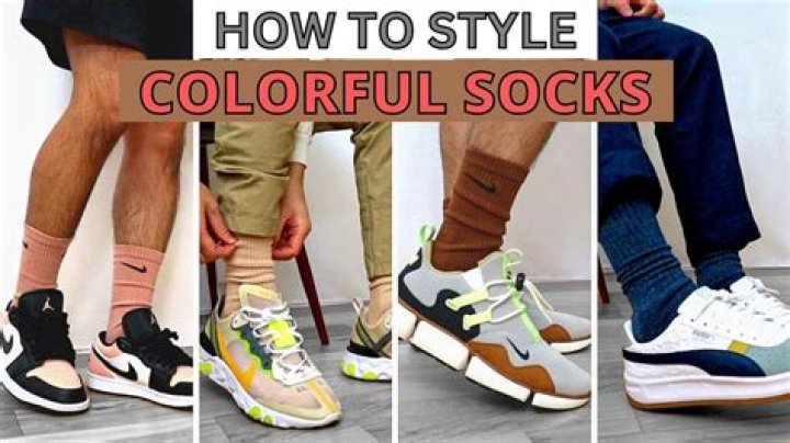 How many socks must the woman select to be sure of having two socks of the same Colour?